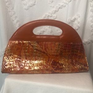 J. RENEE orange/pink patent leather semi circle shaped clutch.